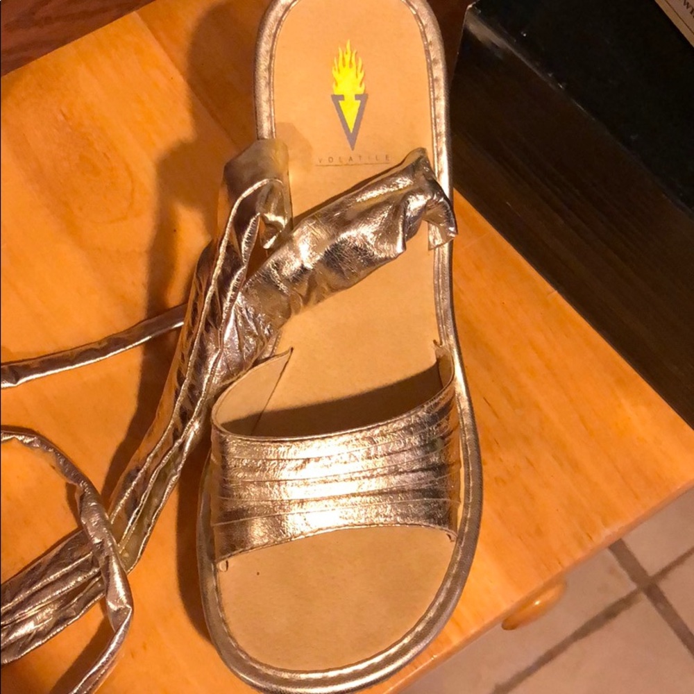 Volatile strappy tie up wedge